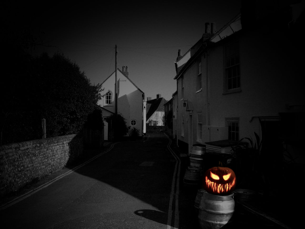 A Jack o Lantern guards a village against evil spirits