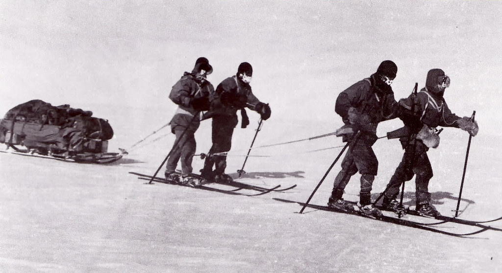 The South Pole team hauling their sleds on the way back to base camp