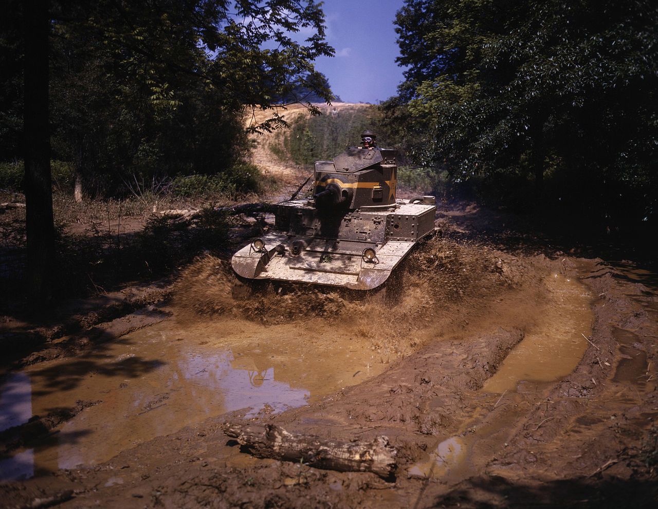 An M3 Stuart light tank going through water obstacle, Ft Knox, KY, 1942