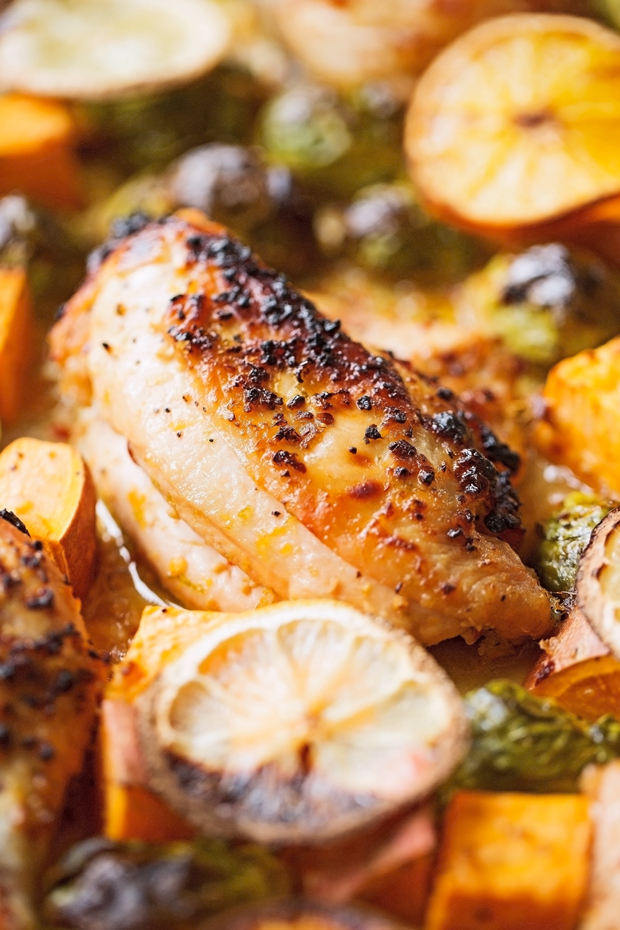 One Sheet Pan Garlic and Citrus Chicken with Brussel Sprouts and Sweet Potatoes - Tender, falling apart chicken with roasted veggies all on ONE sheet pan! #roastedbrusselsprouts #roastedsweetpotatoes #roastedchicken | Littlespicejar.com