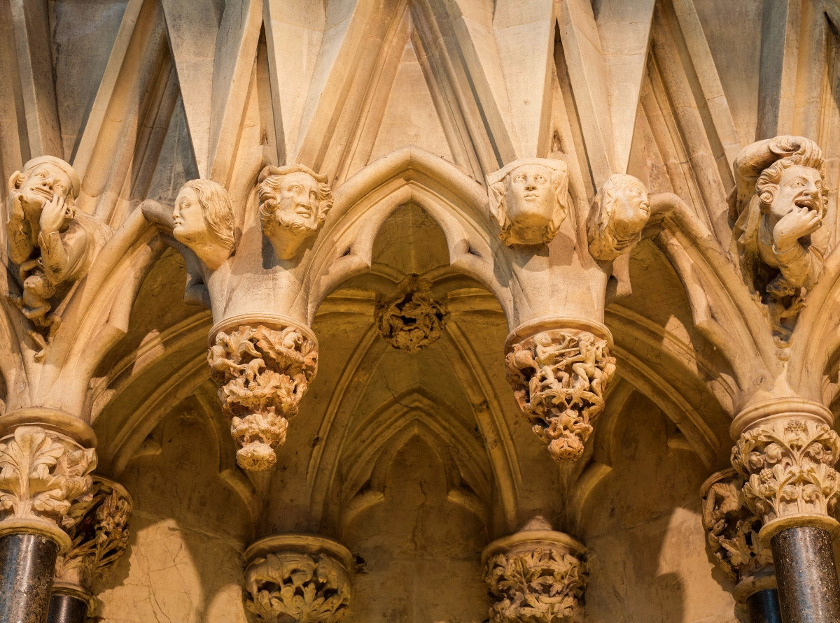 Grotesques on the wall of the chapter house in York Minster. Credit David Iliff