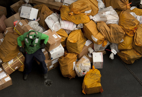 USS Carl Vinson Sailor takes a break before moving mail.