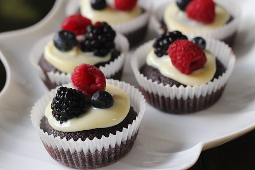 Dark chocolate and white chocolate cupcakes with mixed berries