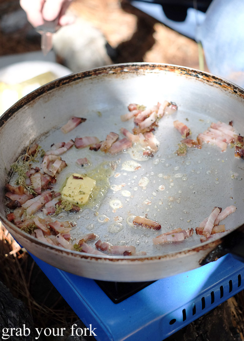 Butter, thyme and bacon in the frypan for cooking mushrooms
