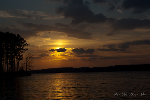 blue trees sunset sky orange lake reflection water yellow canon island alabama