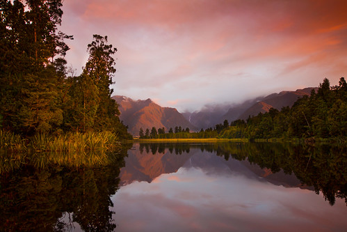 sunset newzealand sky mountain lake reflection tree water canon mirror colours mt cook explore nz southisland 1020mm lakematheson mountcook 50d explored