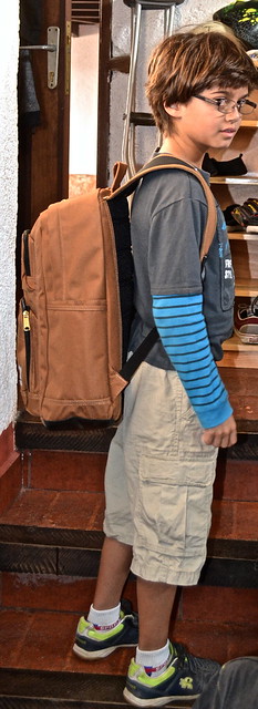 Kid using a brown Carhartt Backpack