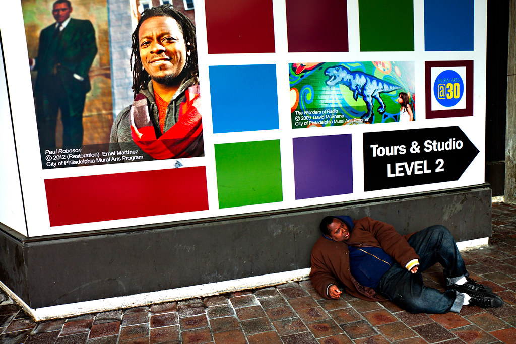 Man-on-ground-outside-The-Gallery-on-4-13-14--Center-City