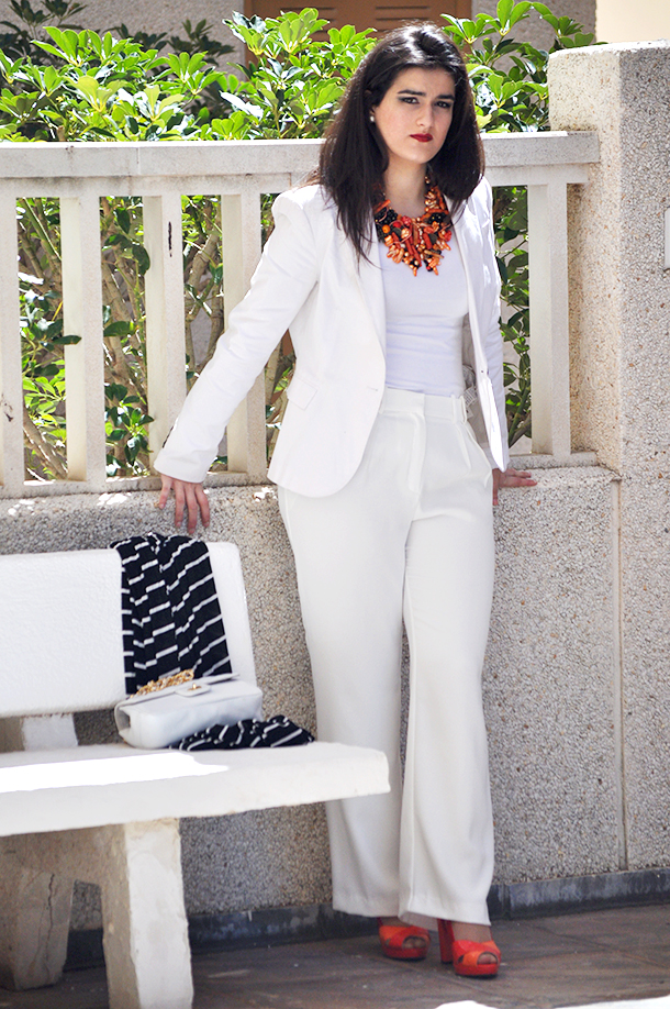 cruise collection outfit inspiration, navy orange statement jewelry necklace, something fashion valencia amanda, white tailored suit geox orange shoes, di carla jewelry valencia