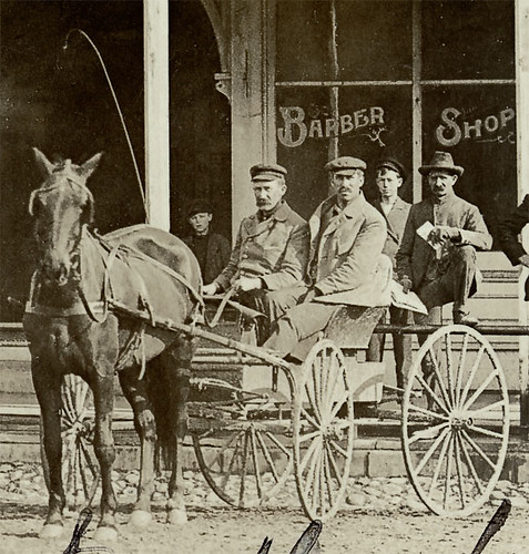 horses people usa signs man men history boys kids buildings bristol walking advertising children clothing workmen mail postoffice hats indiana streetscene bicycles transportation shops pedestrians cigars storefronts buggy buggies businesses barbers realphoto elkhartcounty hoosierrecollections