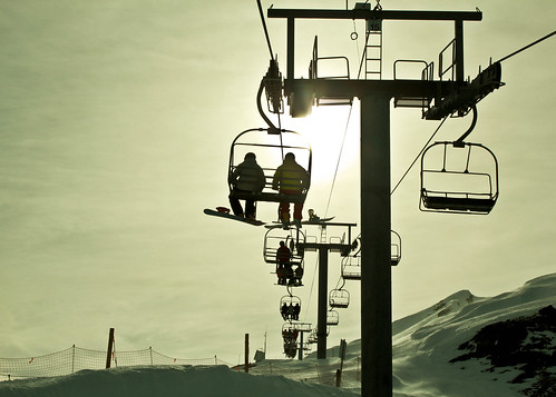 sunset people sun snow ski mountains alps skilift slopes