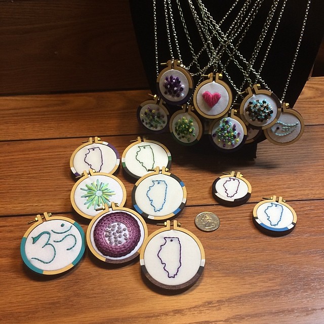 Brooches on the left, necklaces on the right (including 2 of Illinois that don't yet have chains attached). The quarter is for scale. I will have these - and more! - at Urban Farmgirl's Main Street Market at Midway Village in Rockford, IL Saturday, May 10