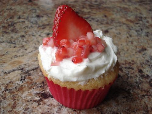 Vanilla Cupcake, White Chocolate Cream Cheese Frosting, Strawberries on Top!