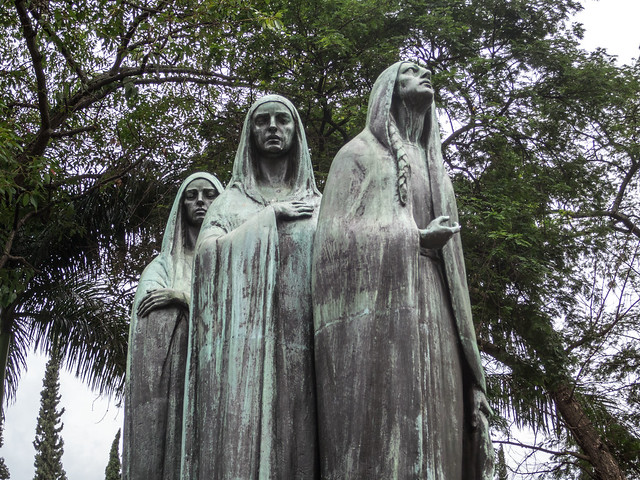 The Three Marias adorn the top of one family grave