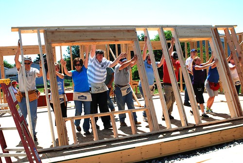 USDA Ohio Rural Development employees help construction workers "walk up a wall" during a day of volunteering at a Marysville, Ohio Habitat for Humanity build. The house, which will belong to Union County resident Michelle Amrine, is the first-ever built-from-the-ground-up collaboration between Habitat for Humanity and Rural Development in Ohio. (USDA Photo by Heather Hartley)