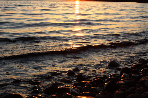 sunset sun lake ontario canada reflection beach rock rocks ripple wave pebbles pebble reflect shore