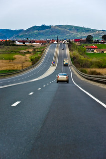 Various vehicles travelling down straight highway