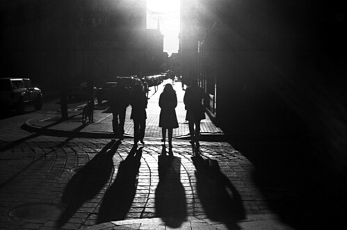 street city light shadow people sun silhouette dark downtown walk streetphotography providence cobblestone strong subject kodakbw400cn yashicaelectro35gsn contast ruckenfigur coloryashinondx45mmf17