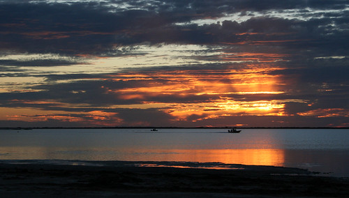 sunset sky water clouds landscape boat