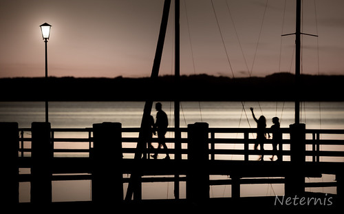 light sunset shadow sky people lake abstract black blur water lamp lines silhouette bulb sunrise dark walking landscape harbor dock hand outdoor jetty blurred lantern persons chiemsee humans unsharp chieming