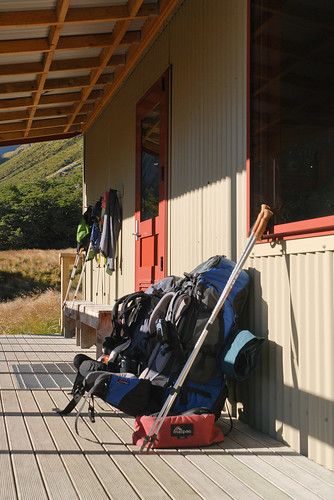 newzealand nature sunrise outdoor hut porch backpack walkingpole speargrasshut tour2011020111 taghut tagnelsonlakes