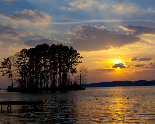 blue trees sunset sky orange lake reflection water yellow canon island alabama