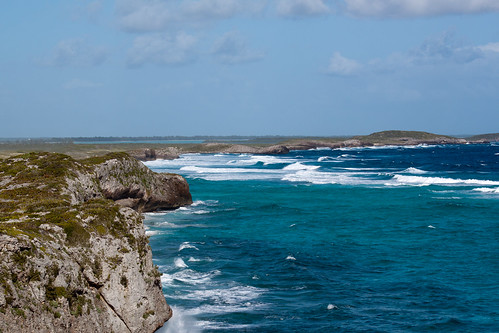 ocean blue cliff water waves coastline turksandcaicosislands middlecaicos mudjinharbor crossingplacetrail