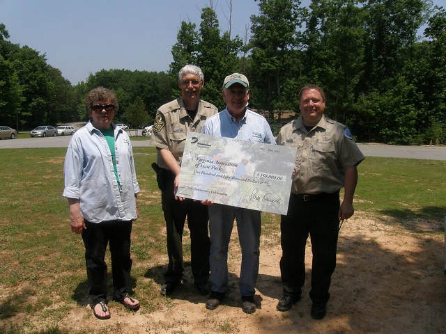 VAFP President Johnny Finch holds a check from Dominion for $150,000, part of more than $1 million secured for Virginia State Parks projects from Dominion by the VAFP