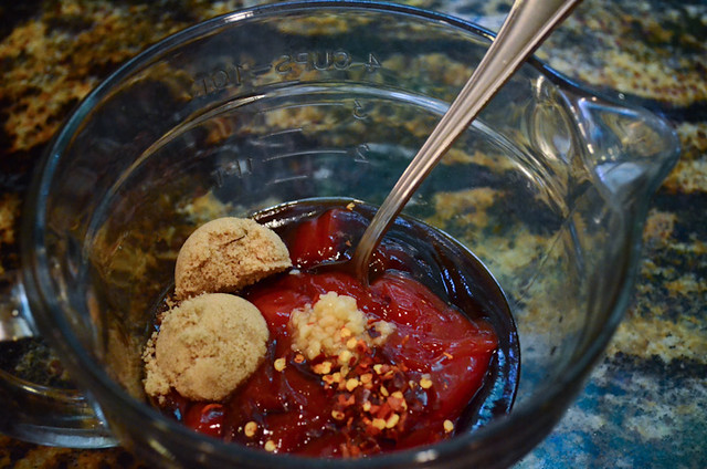 The sauce ingredients are combined in a glass measuring cup.