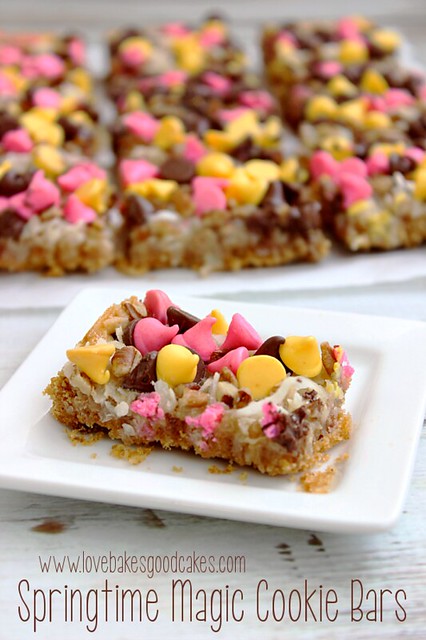 Springtime Magic Cookie Bars are a soft baked graham cracker cookie bar topped with coconut, pecans and Springtime morsels! #cookie #bars #coconut #chocolate