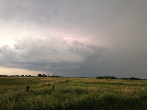 storm grass clouds thunderstorm lightning prairie looming