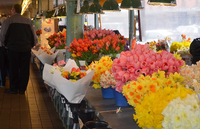 A variety of flowers arranged at a flower stall.