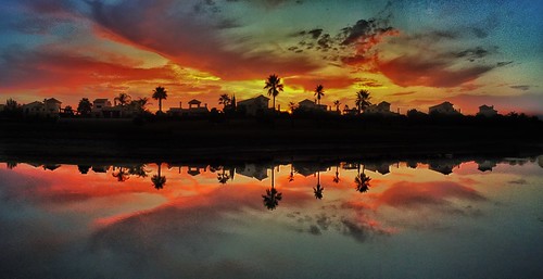 nightfalls dayend symmetrical reflection fire water sunset clouds
