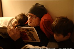 grandpa jeff reading a bedtime story to his grandsons 