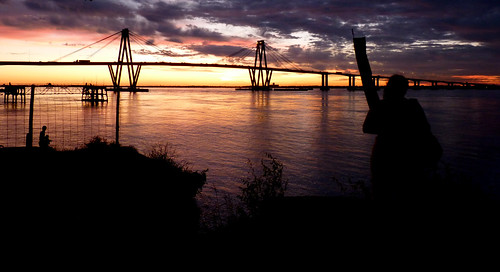 bridge corrientes argentina water river sunset orange sky siluette