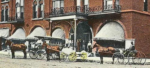 horses people woman usa signs man color men history buildings advertising awning women indiana streetscene transportation pedestrians hotels storefronts sullivan buggy buggies businesses wagons sullivancounty hoosierrecollections