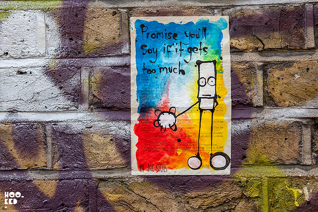 My Dog Sighs London street art paste-ups on Brick Lane, London