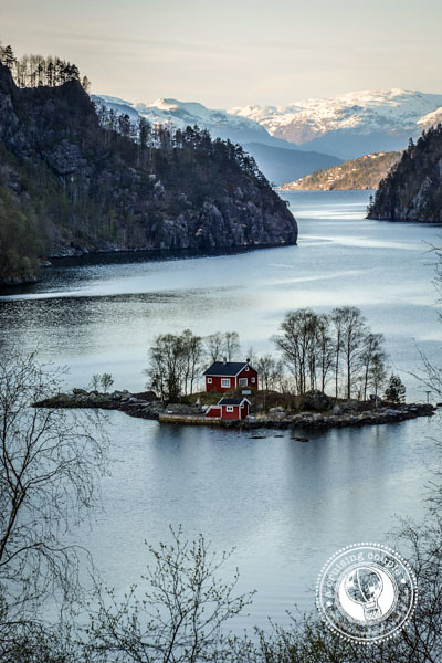 A Norway picture of a red cabin on an island