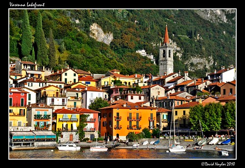 italy orange lake church water yellow architecture buildings boat nikon sailing waterfront vessel steeple 1001nights lakefront varenna lagodicomo d700 davidnaylor theunforgettablepictures
