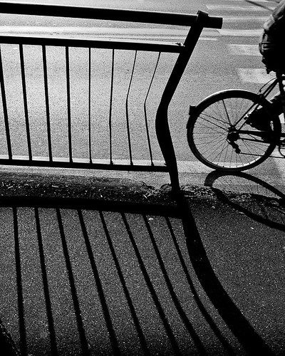 shadow bicycle wheel fence rail crop dubliner