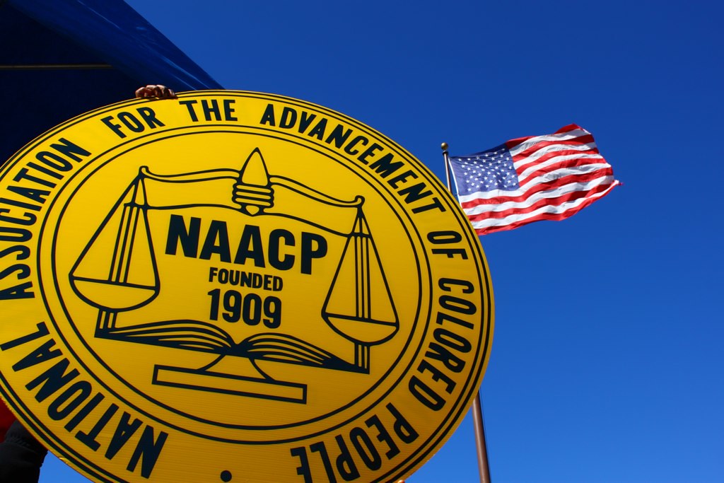 NAACP logo and American Flag