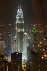View of the Petronas towers from the revolving restaurant at Menara KL