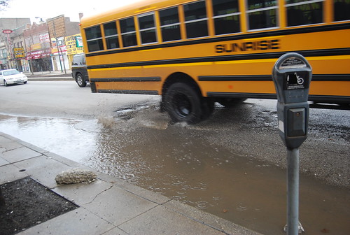 street school chicago bus water yellow sunrise illinois hit hard deep spray il cover transportation manhole schoolbus bender sewer ashland potholes pothole axle whopper waterspray whomp axlebender