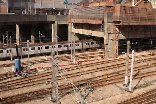 Train entering the east end of the shed at Kowloon Bay depot: buildings on the podium as with every other MTR depot