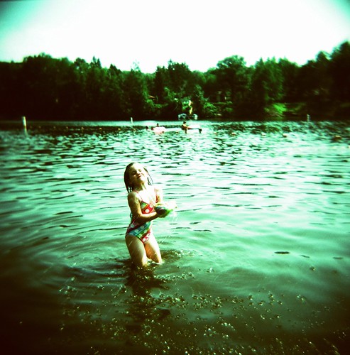 summer lake playing water girl wisconsin kids mediumformat children xpro crossprocessed fuji july 120film catch frisbee summertime splash holga120cfn fujivelvia50 velvia50 2011 chippewafalls chippewacounty lakewissota lakewissotastatepark