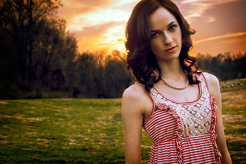 sunset portrait woman girl outdoors warm dress stripes curls pearls tilt curlyhair tiltedhead stripeddress