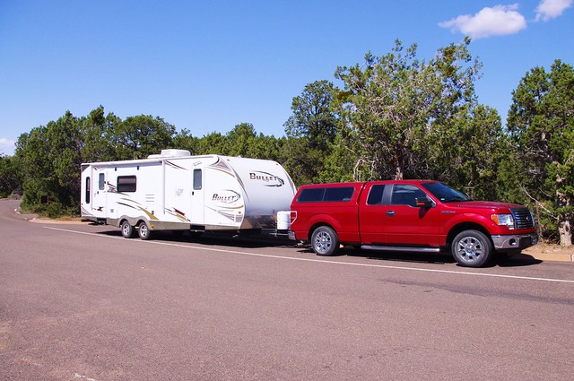 Bullet travel trailer by Keystone, towed by Ford pickup, Navajo National Monument, Arizona, October 1, 2011
