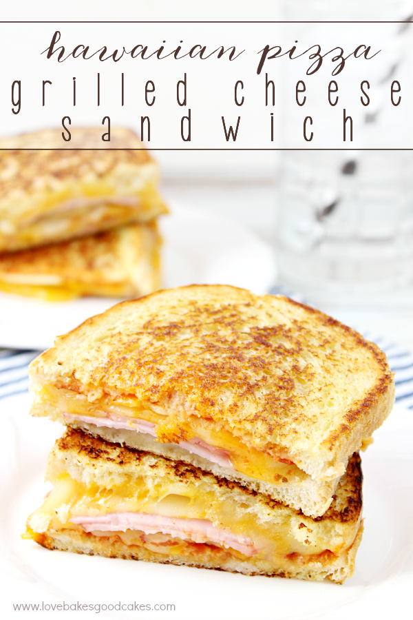 Hawaiian Pizza Grilled Cheese Sandwich cut in half and stacked on a plate.