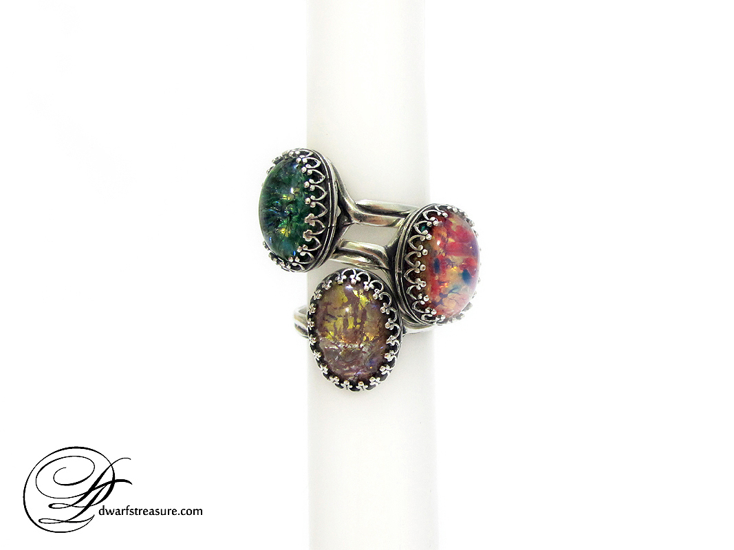ook rings with glass amethyst, fire, and green opal cabochons