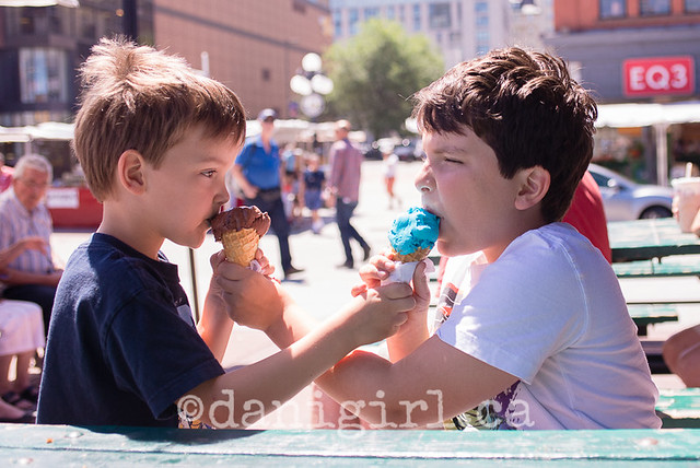 photo of brothers sharing ice cream